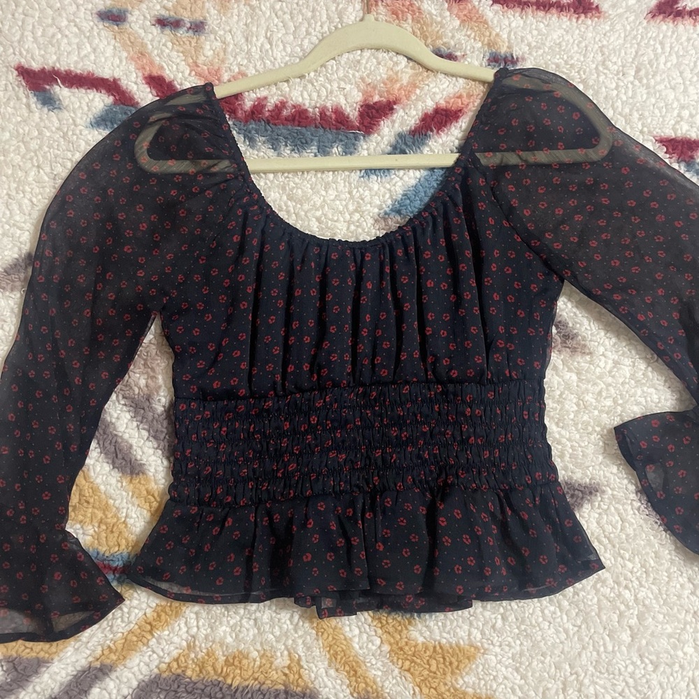 Black blouse with sheer sleeves